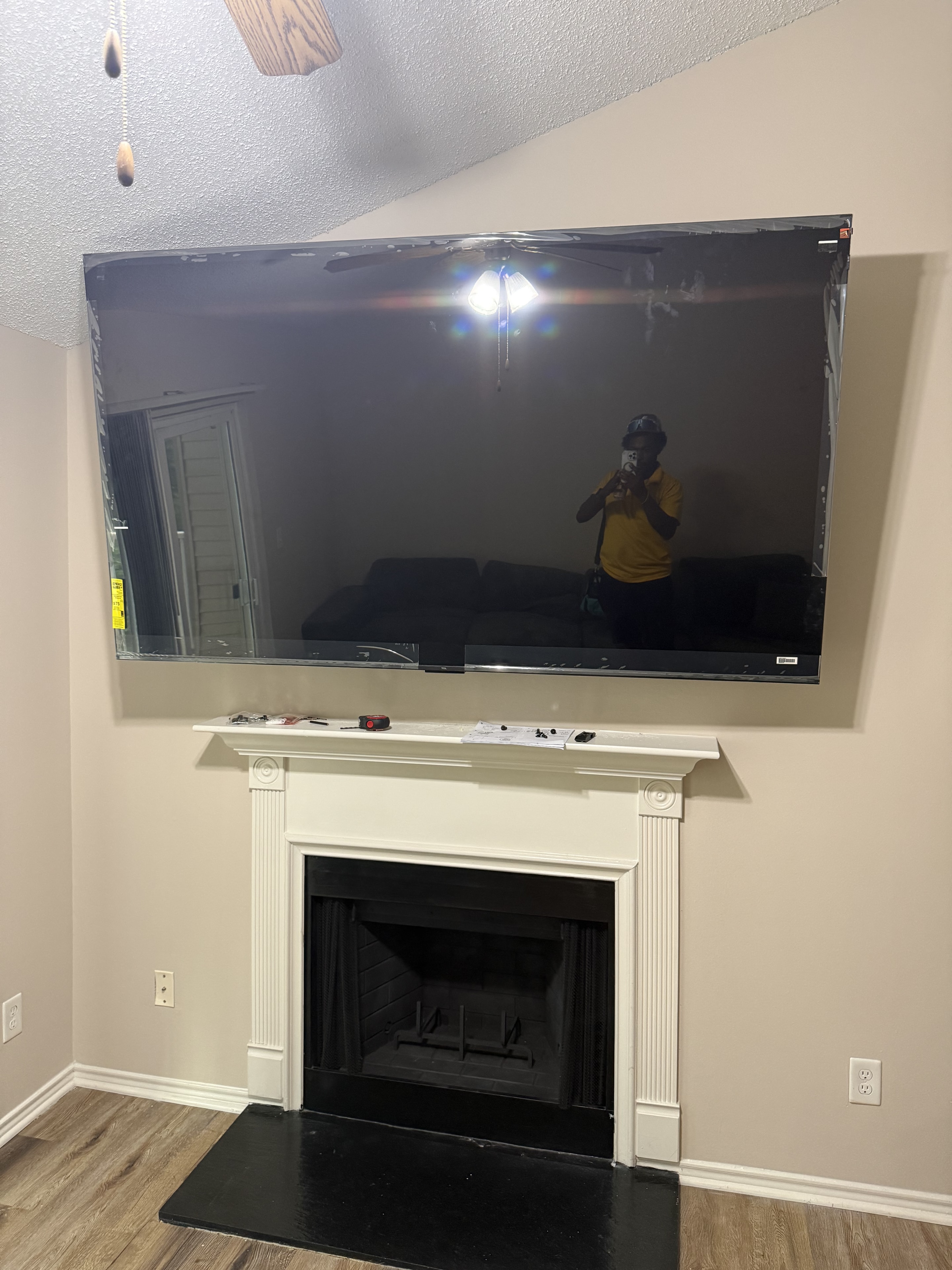 75-inch TV mounted above fireplace — James T. installation